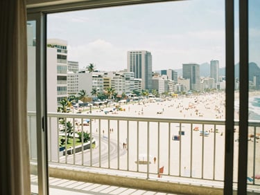bright editorial photography of Copacabana beach view from a high-floor apartment window, sun-drenched balcony, warm coastal tones, 35mm film