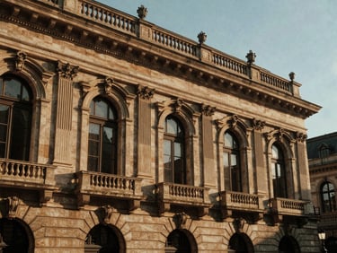 Atmospheric architectural details of a historic European train station, natural side-lighting, rich earthy tones.
