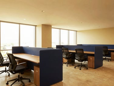 Modern bright office interior in Bengaluru tech park, clean minimalist workspace, warm gold and navy tones, editorial photography
