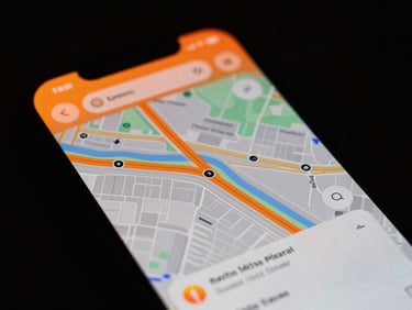Tight macro crop of a glowing mobile interface displaying local map search results, high contrast neon-orange ambient lighting, dark moody background, 35mm