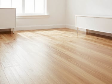 Dust-free hardwood floors in a bright, airy living room, crisp white furniture, filtered natural light, wide-angle