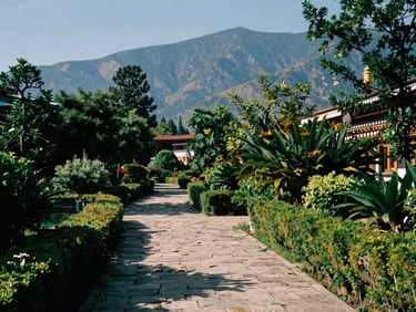 Lush green monastery gardens in Nana, stone pathways under warm natural sunlight