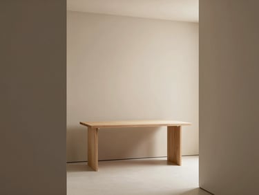Minimalist creative studio workspace, soft diffused north-facing daylight, warm sand beige and muted charcoal tones, architectural framing, 50mm lens