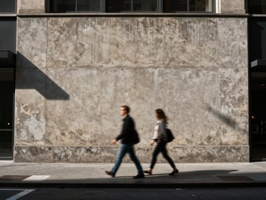 Harsh direct sunlight hitting a concrete facade in New York, a couple caught in motion blur crossing the street, high-contrast shadows.