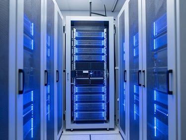Symmetrical view of a pristine data center cold aisle with blue LED lighting on immaculate server racks, 35mm architectural photography