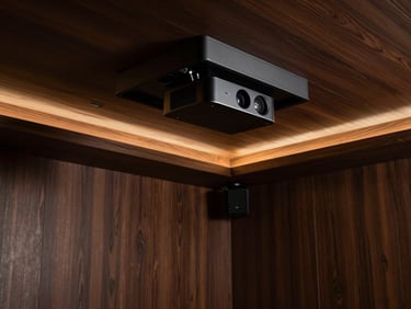 Luxury home cinema, hidden projector retracting into ceiling, dark wood, warm lighting, deep shadows, rich bronze and charcoal tones.
