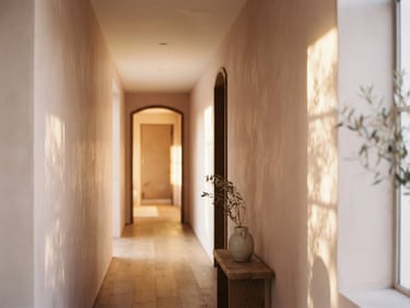 Sun-drenched minimalist corridor with soft shadow play on blush plaster walls, warm golden hour light, 35mm photography