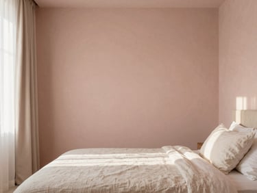 Minimalist luxury bedroom with soft blush plaster walls, raw linen bedding, warm morning light filtering through sheer drapes