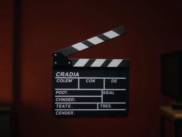 cinematic film still showing a director's clapperboard with neon accents, dramatic chiaroscuro lighting, wide anamorphic aspect ratio