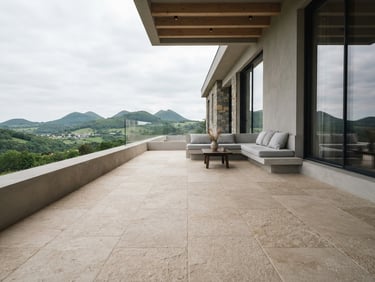 Low-angle architectural exterior photography of a minimalist villa terrace in Puy-de-Dôme, seamless light sand stone carpet floor, soft overcast daylight, 35mm