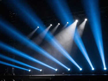 Dramatic stage lighting setup with powerful light blue moving head beams cutting through dense haze, high-contrast, technical view