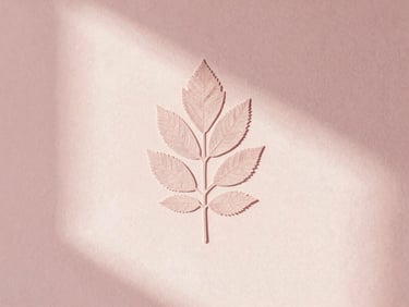 Delicate botanical leaf casting a soft shadow on a warm plaster wall, minimalist beauty concept
