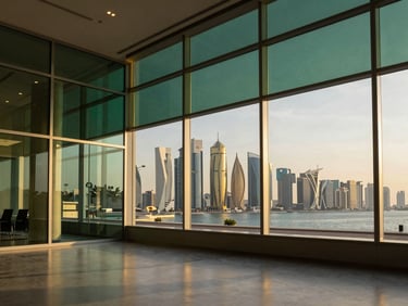 Wide-angle shot of a luxurious executive office interior in West Bay, glass walls overlooking the Doha skyline at golden hour, sharp focus, medium format