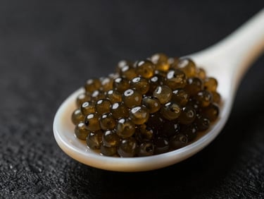 Macro shot of medium-sized, firm brown Oscietra caviar pearls on a mother-of-pearl spoon, dark background, dramatic low-key lighting, shallow depth of field.