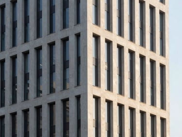 Modern building exterior at golden hour, crisp architectural lines, high-contrast, sharp 35mm lens