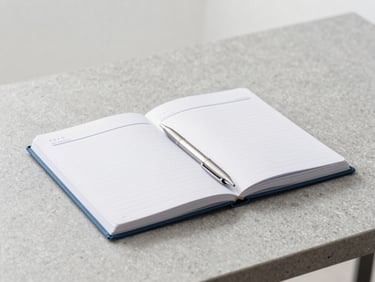 Clean minimalist workspace with an organized planner and a metal pen on a grey stone desk, bright neutral daylight, soft corporate blue tones, sharp focus, 35mm
