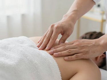 Close-up of expert hands performing precise manual therapy on a patient's shoulder, soft diffused daylight, pristine white towels, light airy environment, 50mm lens.