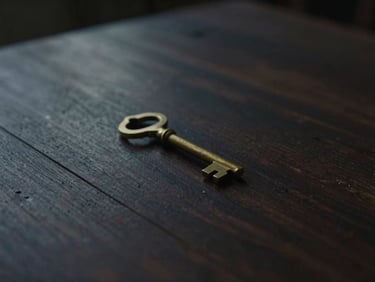 A single brass key resting on a dark rustic wooden table, soft low-contrast twilight lighting, cinematic composition