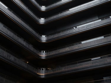 Abstract representation of brand identity architecture, sleek lines, and subtle gold accents, dramatic low-key lighting, premium editorial photography, deep obsidian and metallic tones, cinematic wide-angle, highly detailed, 35mm