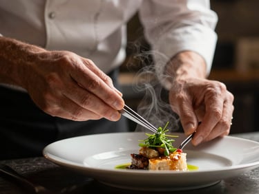 Close-up of a chef's hands using tweezers to place a delicate herb on a plated dish, steam rising in a moody, low-key kitchen, 35mm lens