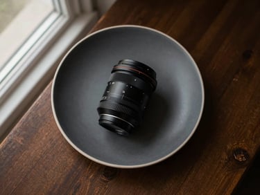 Overhead flat lay of a minimalist Scandinavian-style plated dish, soft natural window light, rich deep tones, 35mm lens