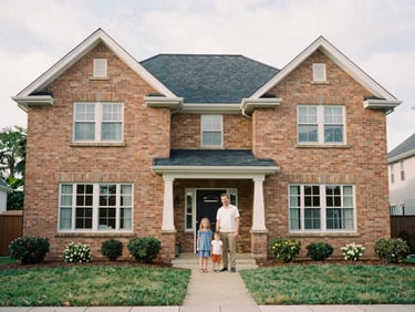 A medium-wide environmental shot of a beautiful family home with a warm brick facade under soft overcast daylight, 35mm film style.