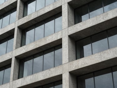 Close-up architectural detail of a modern concrete and glass office building in São Paulo, clean lines, soft shadow, elegant minimalist design