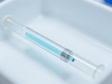 Close-up of a chromatography column for protein purification in a sterile laboratory setting, clean clinical photography, bright high-key laboratory lighting, sterile white and light-blue tones, macro depth of field, 50mm.