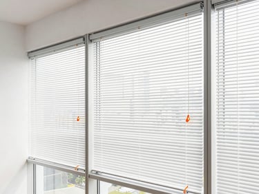 Modern office interior with neatly installed custom blinds, natural daylight, clean lines, professional setting, 35mm