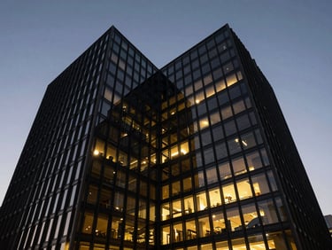 Striking modern building exterior, dramatic angles, glass and steel, twilight, high-contrast architectural lighting, ultra-wide angle lens