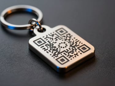 Extreme close-up of a custom metal QR keychain resting on a dark matte surface, warm orange studio key light catching the engraved QR code detail and metallic finish, cool royal-blue rim light on the chain links, sharp focus on the code face, dimensional shadow below