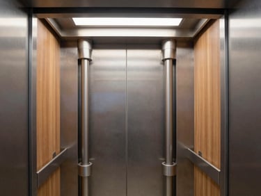 Architectural cross-section of a modern residential elevator shaft showing mechanical guide rails and hydraulic pistons, clean industrial lighting