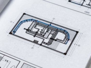 Crisp architectural CAD blueprint of HVAC and hydraulic systems on a screen, cool technical tones, sharp focus, 35mm.