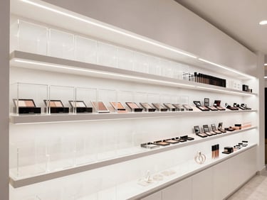 Bright cosmetics shop interior in Kathmandu, custom acrylic makeup organizers, integrated LED shelf lighting, 24mm wide-angle