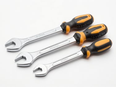 Bright high-key product photography of a professional steel wrench and screwdriver set on a clean white backdrop, crisp studio light, sharp focus, 50mm lens