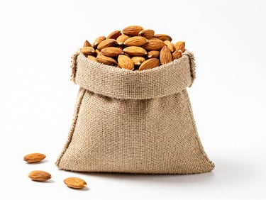 Bright high-key product photography of a large bulk burlap sack filled with raw almonds, crisp white backdrop, sharp focus