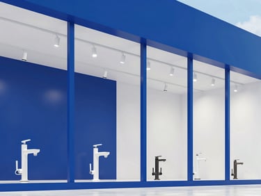 Interior view of a modern architectural hardware showroom, bright cool daylight, bold blue and white tones, crisp clean focus, 35mm lens, featuring sleek bathroom fixtures and track lighting in a structured grid layout.