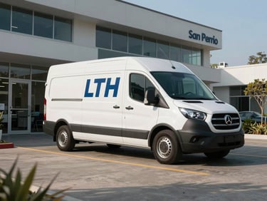 Wide angle shot of a clean, branded LTH service van parked in a modern corporate office driveway in San Pedro, bright morning light, professional setting.