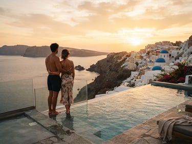 A couple looking out over a private infinity pool in Santorini at sunset, warm golden hour, shallow depth of field, 35mm editorial travel photography