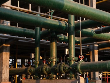 Complex mechanical piping and electrical conduits in a modern industrial plant
