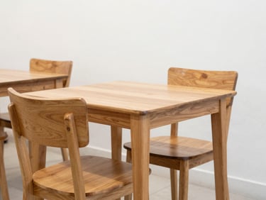 A modern local Malaysian café interior featuring clean, sturdy second-hand wooden tables and chairs, bright welcoming atmosphere.