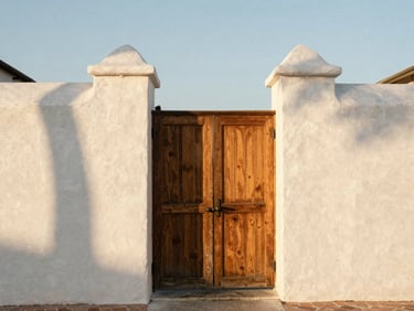 Architectural detail of a historic St. Augustine coquina wall and wooden gate, warm morning light, soft shadows, 35mm