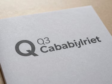 Close-up of a Q3 capability brief cover page, professional design on textured paper, soft natural light, minimalist setting.
