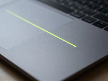 Close-up macro shot of a sleek physical workspace, cool natural daylight, desaturated slate tones, 35mm lens.