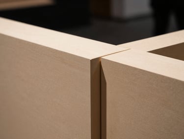 Close-up of a precise architectural joint on an exhibition stand, emphasizing material quality and structural connection, high-contrast, sharp focus, 35mm format