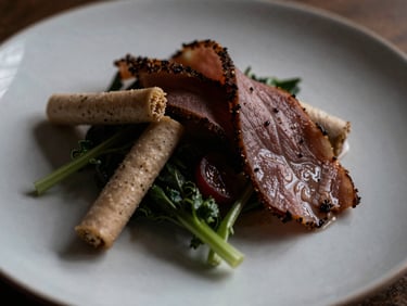 Close-up macro shot of a beautifully plated Scandinavian-style dish, featuring fresh ingredients and minimalist presentation, soft natural side-lighting creating rich shadows. Shallow depth of field.