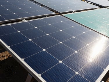 Close-up of high-efficiency solar silicon cells reflecting bright Indian sunlight, macro technical detail