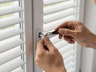 Close-up of a technician's hands repairing a window handle mechanism, clean tools, focused on the technical work, natural daylight, crisp details, 35mm.