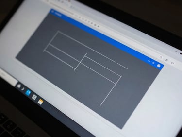 Macro crop of high-contrast UI wireframes on a screen, sharp lines, slate blue accents, cool studio lighting.