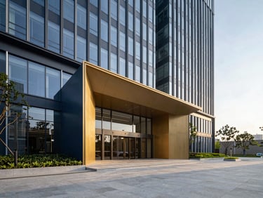 Modern IT park building entrance, sleek architectural details, landscaped corporate plaza, bright daylight